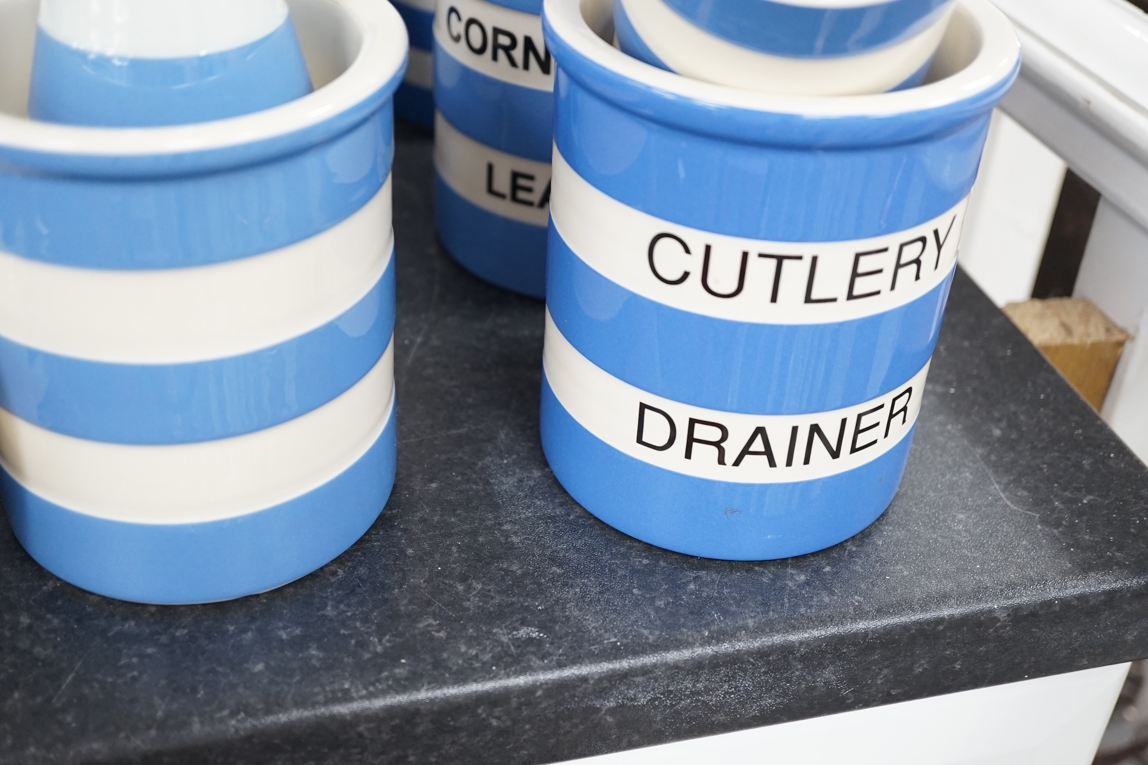 A quantity of modern T.G.Green Cornish Kitchenware, to include lidded storage jars, preserve jars and covers, cups, bowls and jugs, approximately fifty pieces. Condition - fair to good